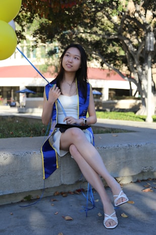 Graduation balloons featuring caps and diplomas.