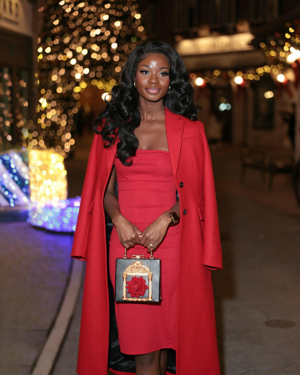 a woman in a red dress and a red coat