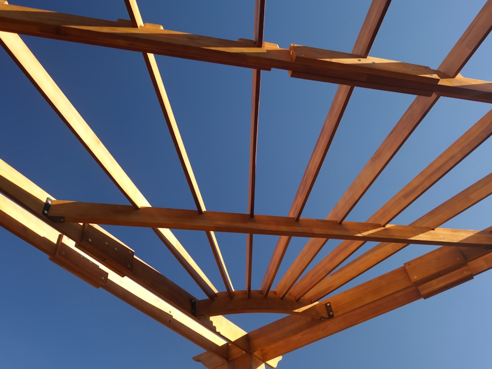 a wooden structure with a blue sky in the background