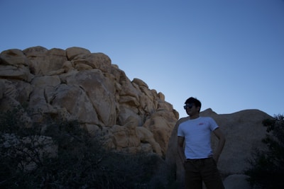 A person standing confidently at sunrise, ready to take on new challenges.