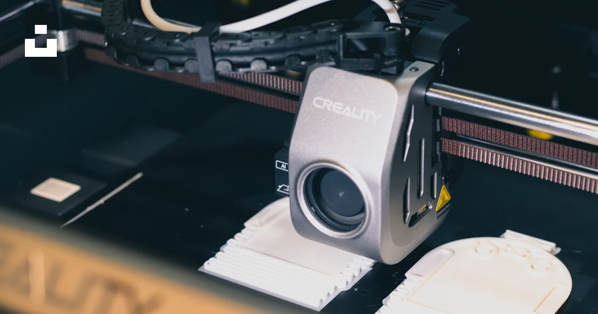 Bottom Camera Logo Machine A close up of a machine with a camera attached to it photo – Free ...