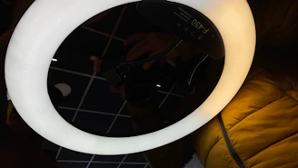 LED ring light glowing warmly illuminating accessories arranged neatly