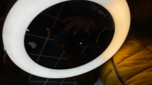 LED ring light glowing warmly illuminating accessories arranged neatly