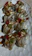 A vibrant plate of assorted sushi rolls with colorful garnishes on a wooden table.