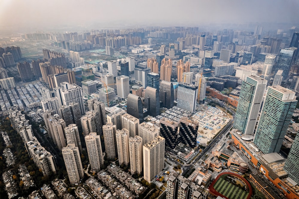 an aerial view of a city with lots of tall buildings