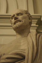 Bust of a Roman emperor with intricate details and a solemn expression.