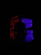 A flickering neon samurai silhouette against a dark, glitchy cityscape.