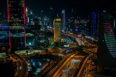 Nighttime shot of a city skyline with highlighted infrastructure representing vital national objects.