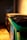 A row of industrial dumpsters with the closest one painted green, set against a dimly lit wall. Shadows and warm light create a moody atmosphere.