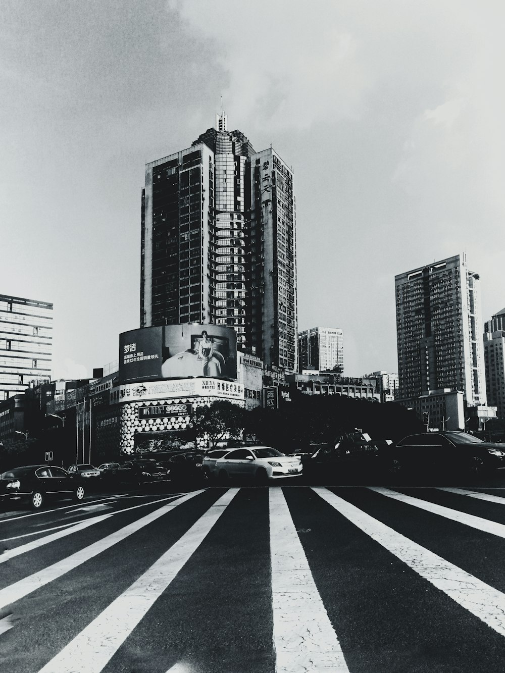 a black and white photo of a city with tall buildings