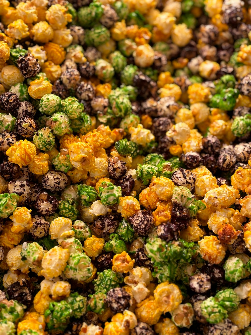 a close up of a mixture of popcorn and broccoli