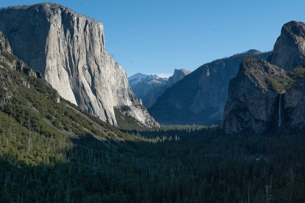 a view of a valley with mountains in the background