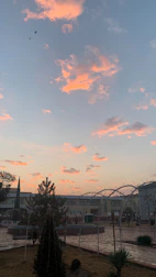 A serene outdoor space set up for a small group meditation session at sunset.