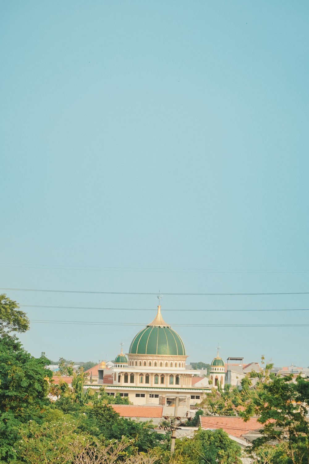 a large building with a green dome on top of it