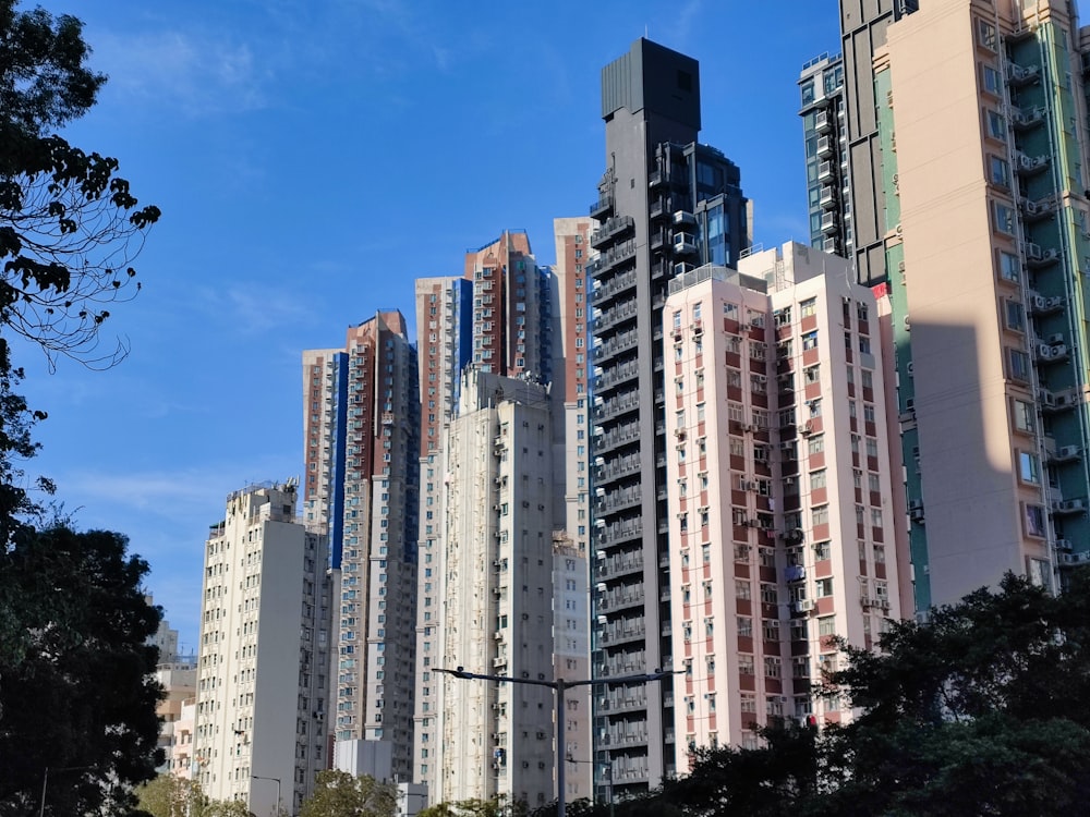 a city filled with tall buildings under a blue sky