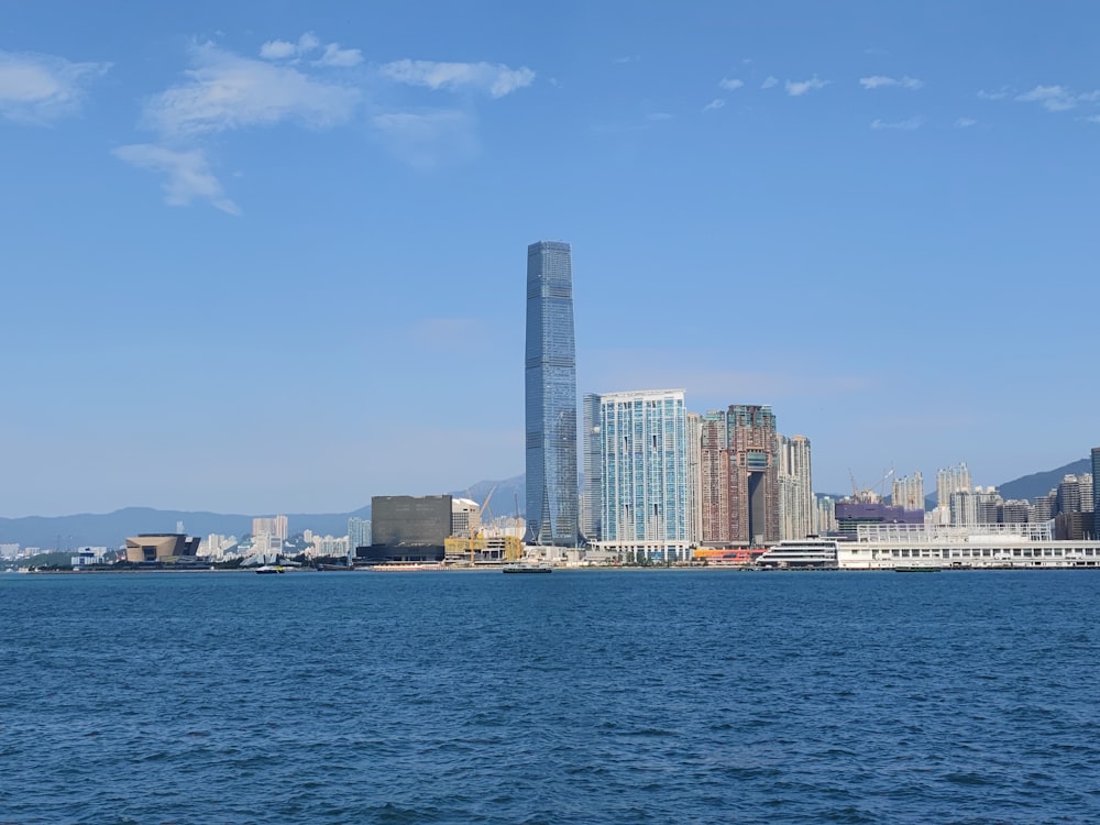 a large body of water with a city in the background