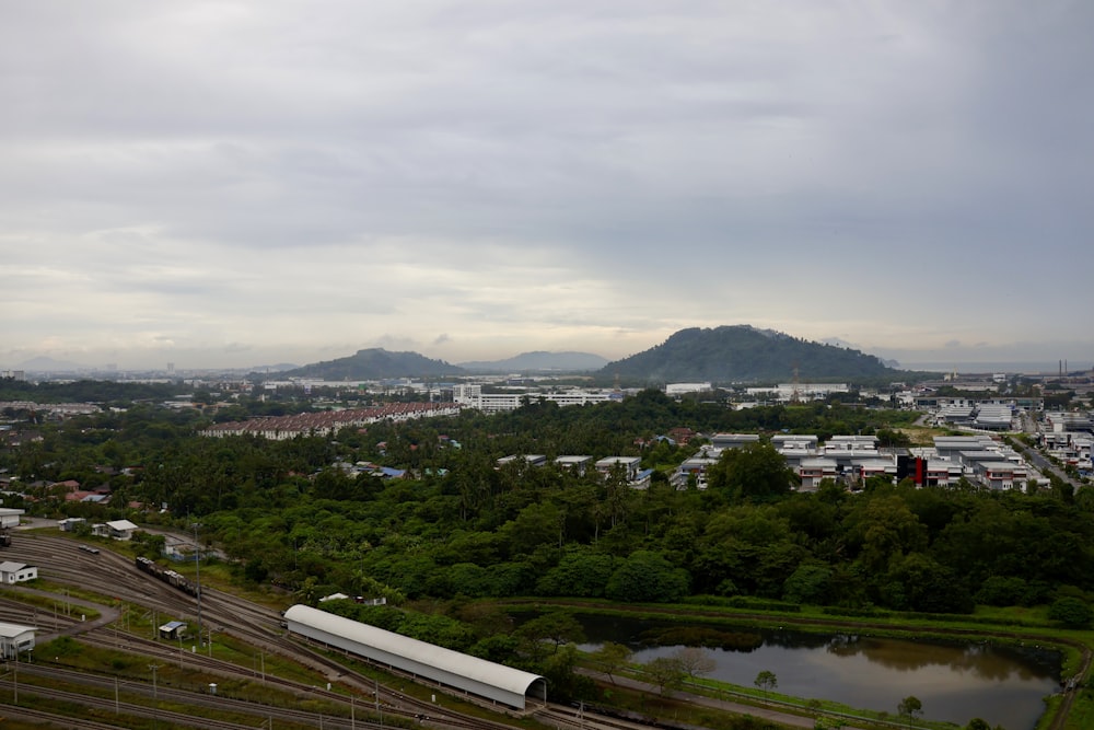 an aerial view of a city with a mountain in the background