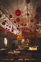 Elegant dining area featuring crimson red and forest green decor.