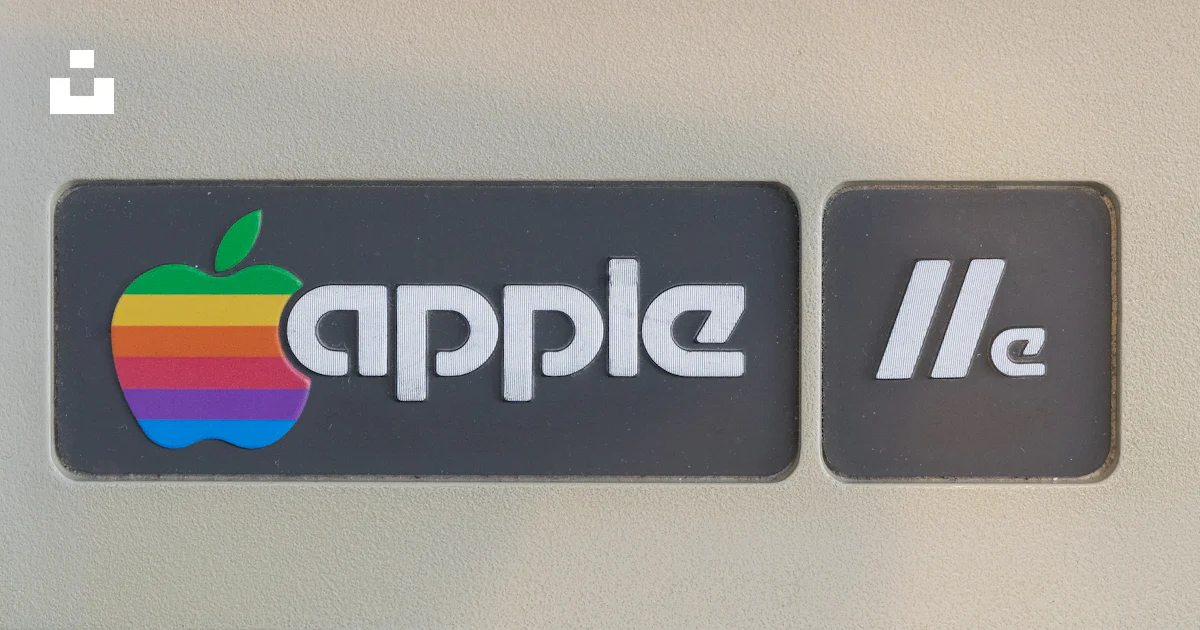 A close up of a sign with an apple logo photo – Free Apple ii Image on ...