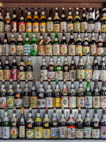 A selection of traditional Japanese sake bottles displayed elegantly on a shelf.