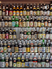 A colorful assortment of traditional Japanese beverages displayed on a wooden table.