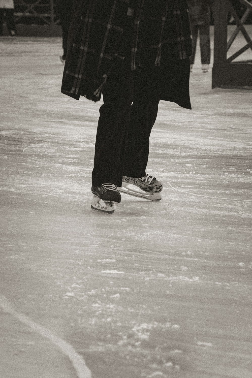 a black and white photo of a person on a skateboard