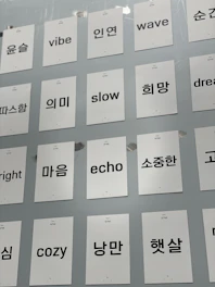 A close-up of colorful flashcards with English words and pictures for vocabulary building.