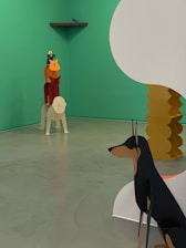 The image depicts an art installation featuring minimalist, stylized animal sculptures. In the foreground to the right, a large black and tan dog sculpture is partially obscured by a white and yellow abstract structure. In the background, several colorful animal sculptures are stacked on top of each other forming a totem-like arrangement against a green wall. A small bird sculpture is perched on a shelf in the top left corner.