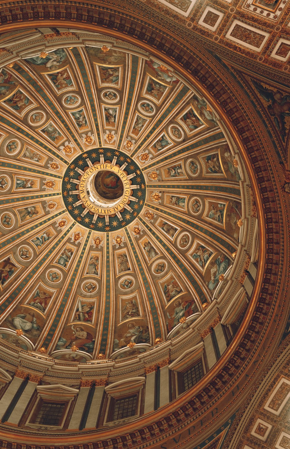 a domed ceiling in a building with intricate designs