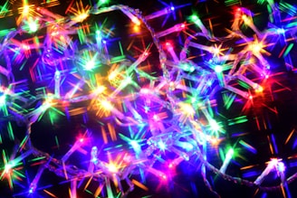 A close-up of vibrant Christmas lights in various colors.