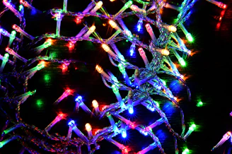 Colorful LED string lights draped around a festive Indian courtyard.