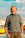 a man standing in front of a body of water