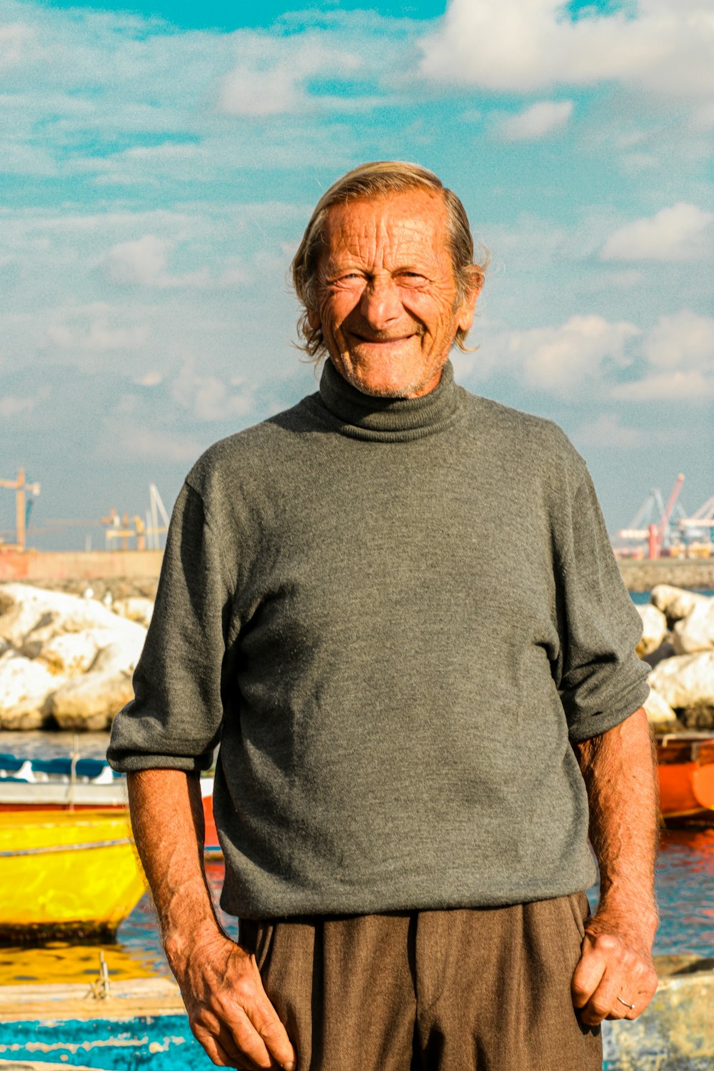 a man standing in front of a body of water