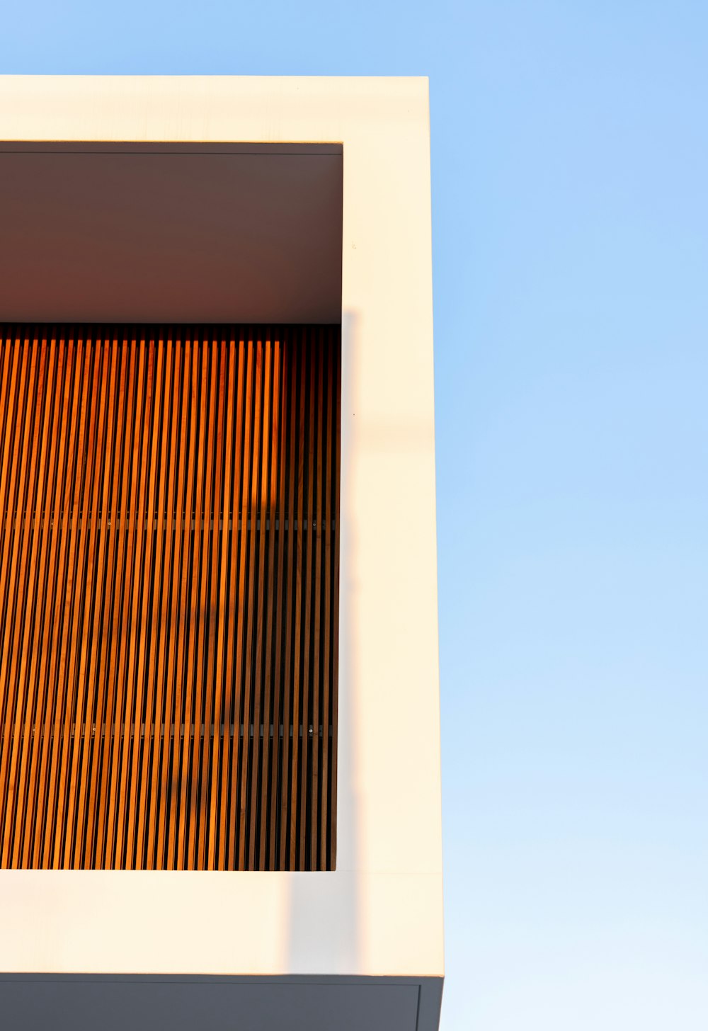 a close up of a building with a sky background