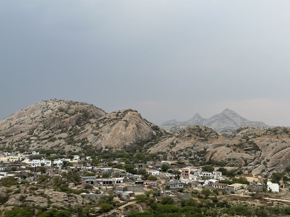 a view of a small town in the mountains