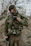 Close-up of a satisfied customer wearing tactical gear outdoors.