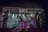 Energetic performers battling it out on stage under bright lights