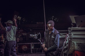 Close-up of high-quality audio and video equipment being used during a lively event.