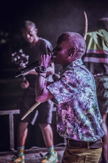 Close-up of a performer passionately delivering spoken word poetry on stage.