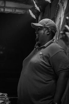 A candid photo of Polo Vásquez engaging warmly with community members during a local event.