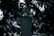 A performer, wearing a cap and sunglasses, is on stage facing a large, densely packed crowd. The scene is in black and white, highlighting the energy and excitement of a live performance with the audience engaging and taking photos.