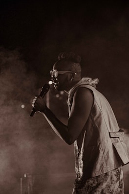 Close-up of Sebas Palacio holding a microphone during a live performance