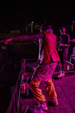 A vibrant image of Pezera performing on stage.