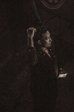 A solitary person looking at a phone with an ignored message, surrounded by a dark emotional atmosphere with rain and cold light in green and black tones.