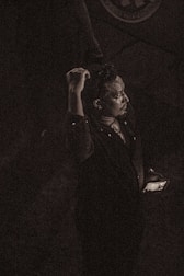 A moody, suspenseful moment from a vertical thriller series on a mobile device.