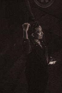 A moody, suspenseful moment from a vertical thriller series on a mobile device.