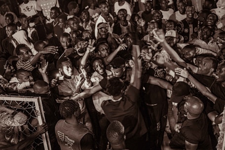 An energetic event activation scene with a crowd engaging enthusiastically with branded experiences.