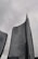 Tall, modern skyscrapers with curved facades rise against a cloudy sky, one bearing the UniCredit logo near its top.