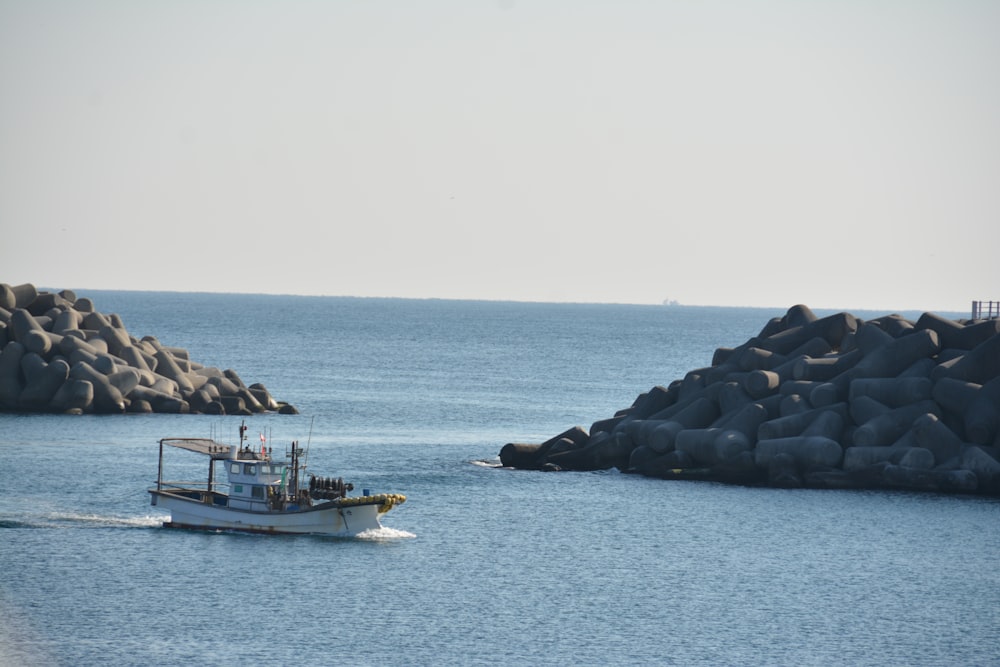 a small boat in a large body of water