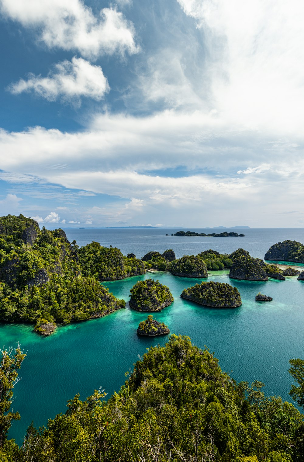 a group of small islands in the middle of a body of water